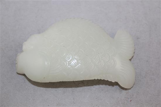A Chinese white jade carving of dragon-fish, 8.5cm.